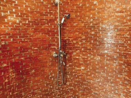 An outdoor shower at the Mala villas